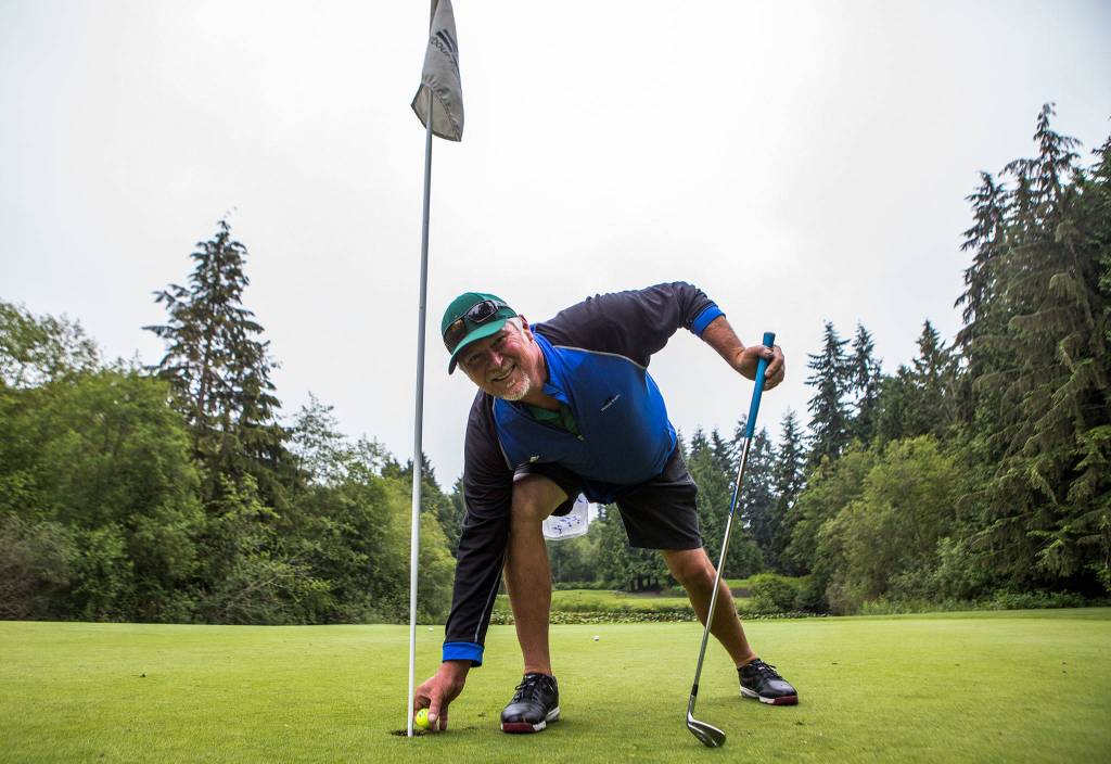 Wayne Lauerman at the 7th hole where he made his hole-in-ones one month apart at Harbour Pointe Golf Club on July 3 in Everett. (Olivia Vanni / The Herald)