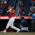 The Angels Mike Trout follows through on a two-run home run during the third inning of a game against the Mariners on July 13, 2019, in Anaheim, Calif. (AP Photo/Marcio Jose Sanchez)