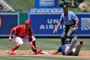 Seattle Mariners Dylan Moore (right) steals second base as Los Angeles Angels shortstop David Fletcher awaits the throw during the second inning of Sundays game in Anaheim, California. (AP Photo/Marcio Jose Sanchez)