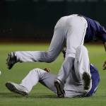 The Mariners Austin Nola (top) collides with Domingo Santana after trying to make a catch on a ball hit by the Athletics Marcus Semien during the seventh inning of a game on July 16, 2019, in Oakland, Calif. (AP Photo/Ben Margot)