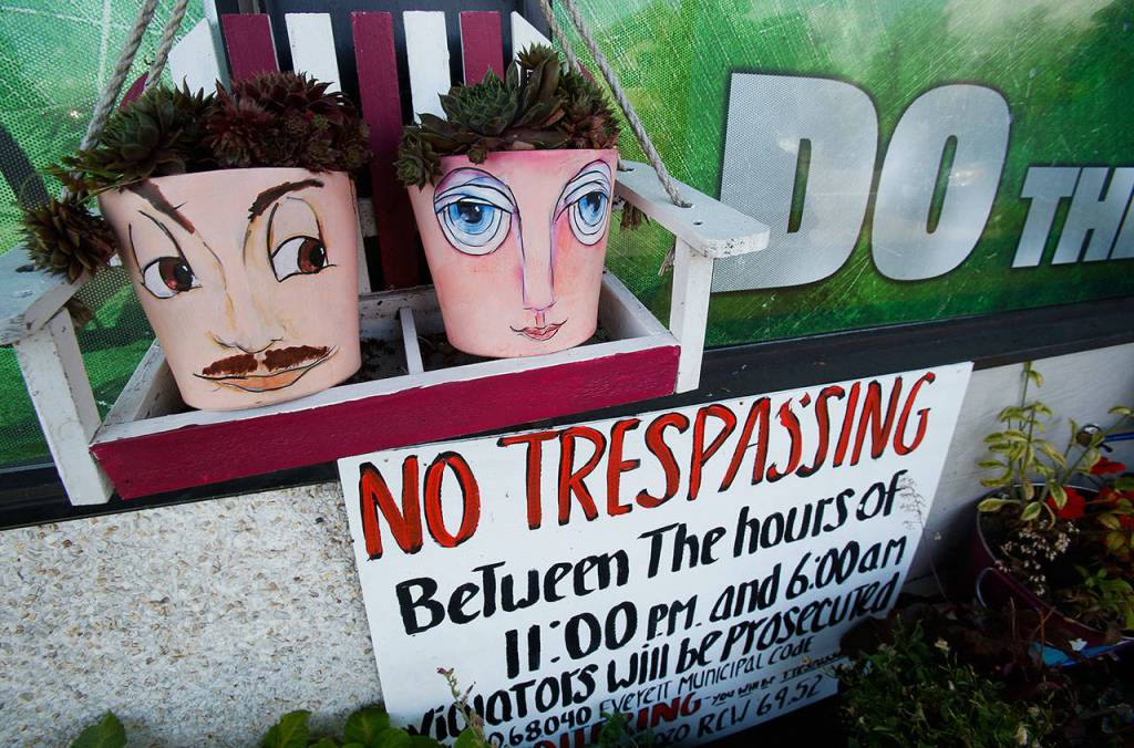 Thanks to Brenda Humbert, faces decorate pots with little chicks-and-hens in front of Welchs Food next door to Humberts shop. (Dan Bates / The Herald)