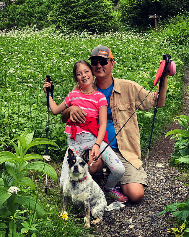 Together with James the dog, Everett residents Hazel Loerch and her dad, Jerry Weatherhogg, stroll up the trail to Independence Lake off of the Mountain Loop Highway. (Jessi Loerch)