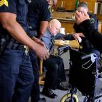 William Talbott II is helped to a wheelchair by Snohomish County Sheriffs Deputies after being found guilty on June 28 in the 1987 killings of Tanya Van Cuylenborg and Jay Cook. Jurors deliberated for more than two days before reaching their verdict in the trial that hinged on 32-year-old DNA evidence and genealogical technology. (Kevin Clark/The Herald via AP, Pool file)