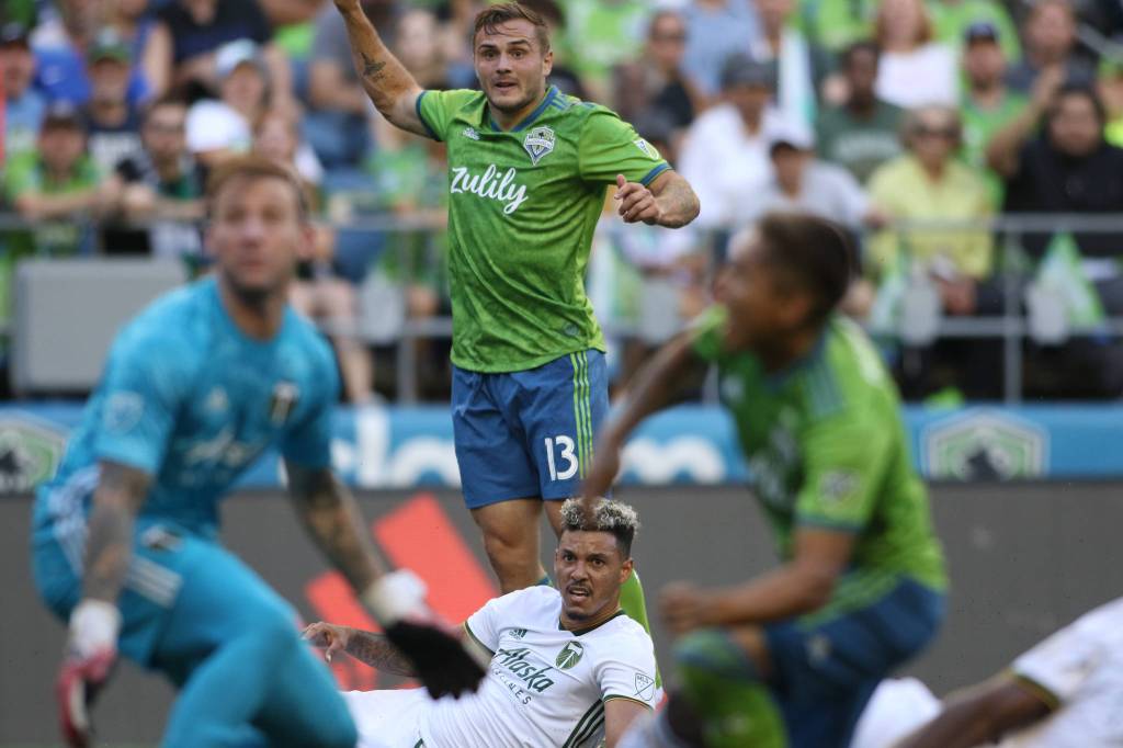 Seattles Jordan Morris and Portlands Brian Fernandez watch the action near the goal as the Seattle Sounders lost 2-1 to the Portland Timbers at CenturyLink Field on Sunday, July 21, 2019 in Seattle, Wash. (Andy Bronson / The Herald)                                Seattles Jordan Morris and Portlands Brian Fernandez watch the action near the goal as the Seattle Sounders lost 2-1 to the Portland Timbers at CenturyLink Field on Sunday, July 21, 2019 in Seattle, Wash. (Andy Bronson / The Herald)
