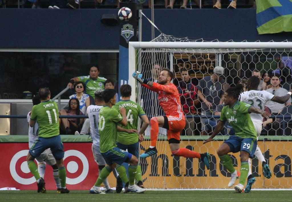 Seattle goalie Stefan Frei punches the ball out on a corner kick as the Seattle Sounders lost 2-1 to the Portland Timbers at CenturyLink Field on Sunday, July 21, 2019 in Seattle, Wash. (Andy Bronson / The Herald)