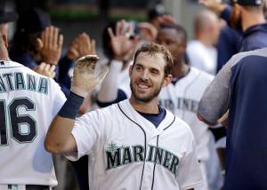 The Seattle Mariners Austin Nola is congratulated on his three-run home run against the Texas Rangers in the second inning of a baseball game Monday, July 22, 2019, in Seattle. (AP Photo/Elaine Thompson)