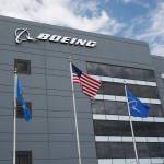 In this May 14 photo, flags fly outside the main building of The Boeing Companys Oklahoma City facility in Oklahoma City. (AP Photo/Sue Ogrocki, File)