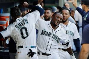 Beckham hits grand slam, Mariners throttle Tigers