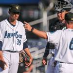AquaSox manager Louis Boyd (right) calls for a relief pitcher to replace Deivy Florido (left) with catcher Juan Camacho looking on during a game against the Dust Devils on July 28, 2019, at Funko Field at Everett Memorial Stadium. (Kevin Clark / The Herald)