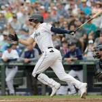 Seattles Ryan Court socks an RBI single for his first major-league hit during the Mariners 8-1 win over Detroit on Saturday in Seattle. (AP Photo/Ted S. Warren)