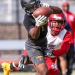 Lincolns Majesty Irvin makes a catch with Kennedy Catholics AJ Keys trailing Saturday afternoon during the Cougar Championship Passing Tournament at Lakewood High School in Marysville on July 27, 2019. (Kevin Clark / The Herald)
