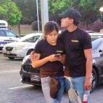 A young couple embrace at a parking lot after a shooting at the Gilroy Garlic Festival in Gilroy, California, on Sunday. (AP Photo/Thomas Mendoza)