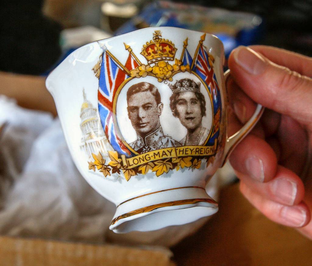 This 1939 teacup commemorates a visit to Canada by Britains Queen Elizabeth and King George VI. Everetts Carol Wheeler plans to sell it during Saturdays Mother of All Garage Sales. (Dan Bates / The Herald)