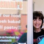 Linda Van Eyck serves a customer from her food truck, Mama Shoshanas, during Kla-Ha-Yah Days. (Kevin Clark / The Herald)