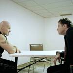 Ansel Schneider (Ralf Scheepers) is interrogated by Detective Armitage (Kevin Cusick) in Devils Five. (Mantaray Pictures LLC/Cool Creative/HERMANOfilms)