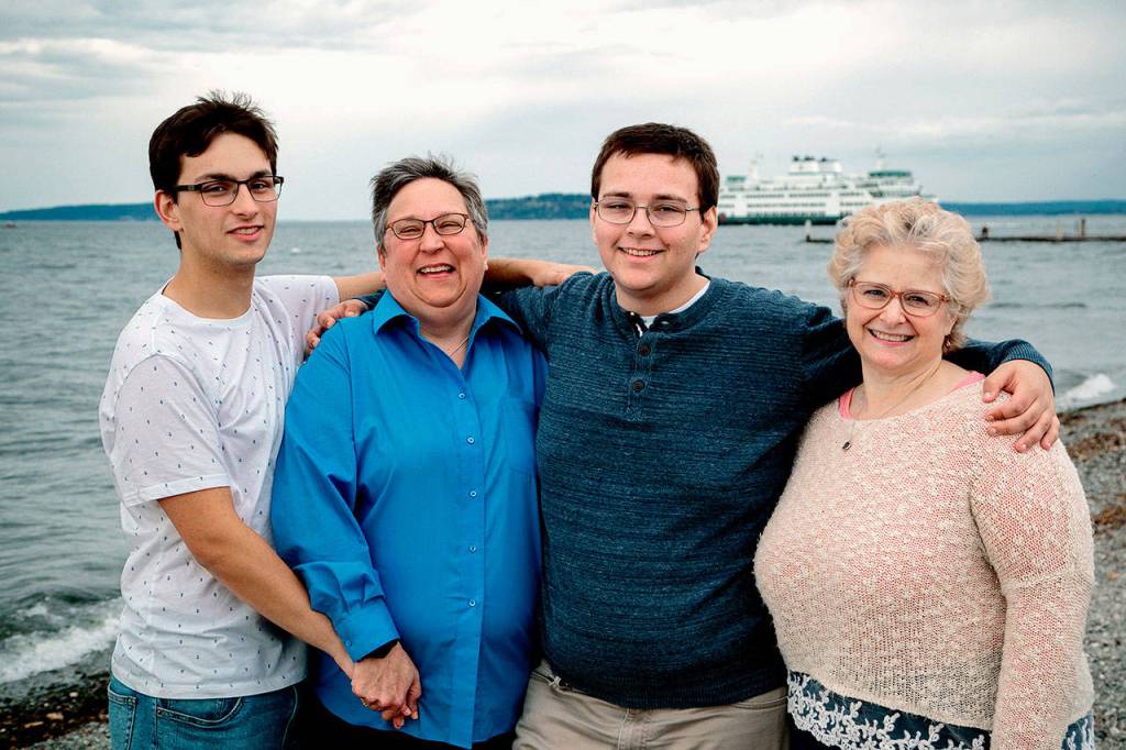 Ian Davis-Leonard (left) and his brother Sam hug their moms Amy Leonard (left) and Betsy Davis Currier. Ian Davis-Leonard has been The Heralds news intern this summer. Hell soon begin his senior year at Gonzaga University. (Photo courtesy Ian Davis-Leonard)