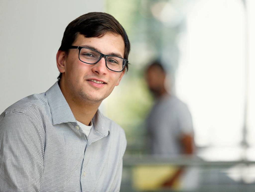 Ian Davis-Leonard takes a break from his desk earlier this week. The Heralds news intern this summer, Ian was a 3-year-old when columnist Julie Muhlstein featured his family in a column. (Dan Bates / The Herald)