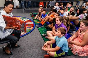 Librarian of Congress Carla Hayden reads Its Only Stanley by Jon Mgee to youngsters while visiting Sno-Isles Marysville Library last week with Congressman Rick Larsen. Appointed by President Barack Obama, Hayden is the first woman and first African-American to hold the position. (Dan Bates / The Herald)