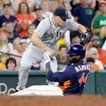 Seattles Kyle Seager (left) jumps out of the way of a slide by Houstons Yordan Alvarez (right) at third base on a force play during the fourth inning of the Astros 3-1 win over the Mariners in Houston. (AP Photo/Michael Wyke)