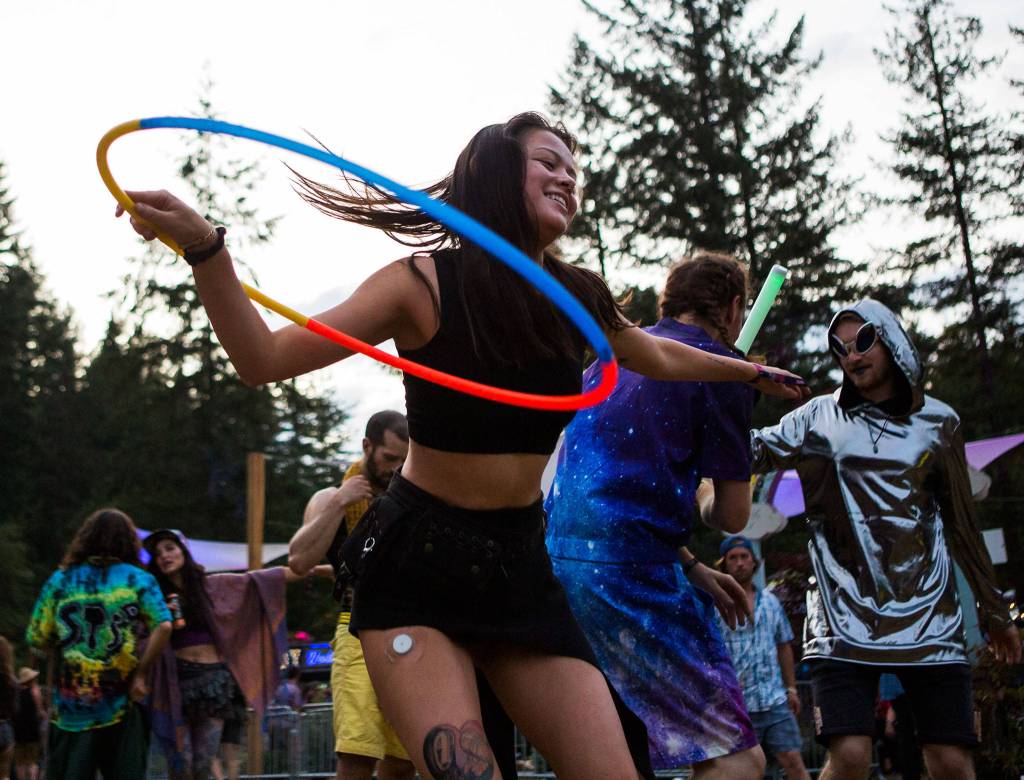 Sarah Valuet hoops during Umphreys McGee during the second day of Summer Meltdown on Friday, Aug. 2, 2019 in Darrington, Wash. (Olivia Vanni / The Herald)
