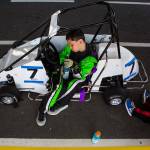 Holden Gorski, 11, rests in his car before the start of his race at the Washington Quarter Midgets Associations Wild Wild West race on Aug. 4 in Monroe. (Olivia Vanni / The Herald)