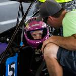 Jessica Davis, 8, gets a pep talk from her crew chief, Paul Wagar, before the start of her race at the Washington Quarter Midgets Associations Wild Wild West race on Aug. 4 in Monroe. (Olivia Vanni / The Herald)
