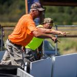 Parents and spectators yell and signal to the racers during the Washington Quarter Midgets Associations Wild Wild West race on Aug. 4 in Monroe. (Olivia Vanni / The Herald)