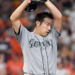Seattles Yusei Kikuchi wipes his brow after giving up a triple to Houston Astros George Springer during an Aug. 2 game in Houston. (AP Photo/Eric Christian Smith)