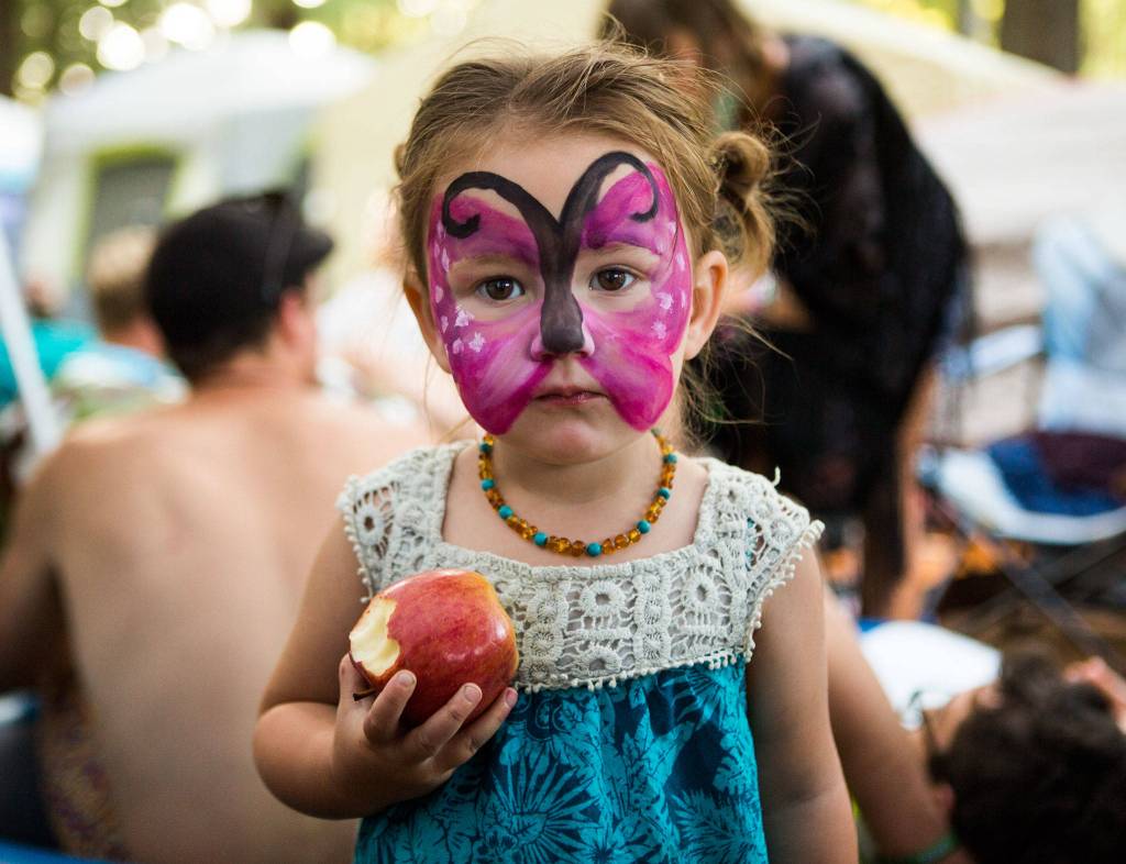 Nadine shows off her butterfly facepaint during the third day of Summer Meltdown on Saturday, Aug. 3, 2019 in Darrington, Wash. (Olivia Vanni / The Herald)