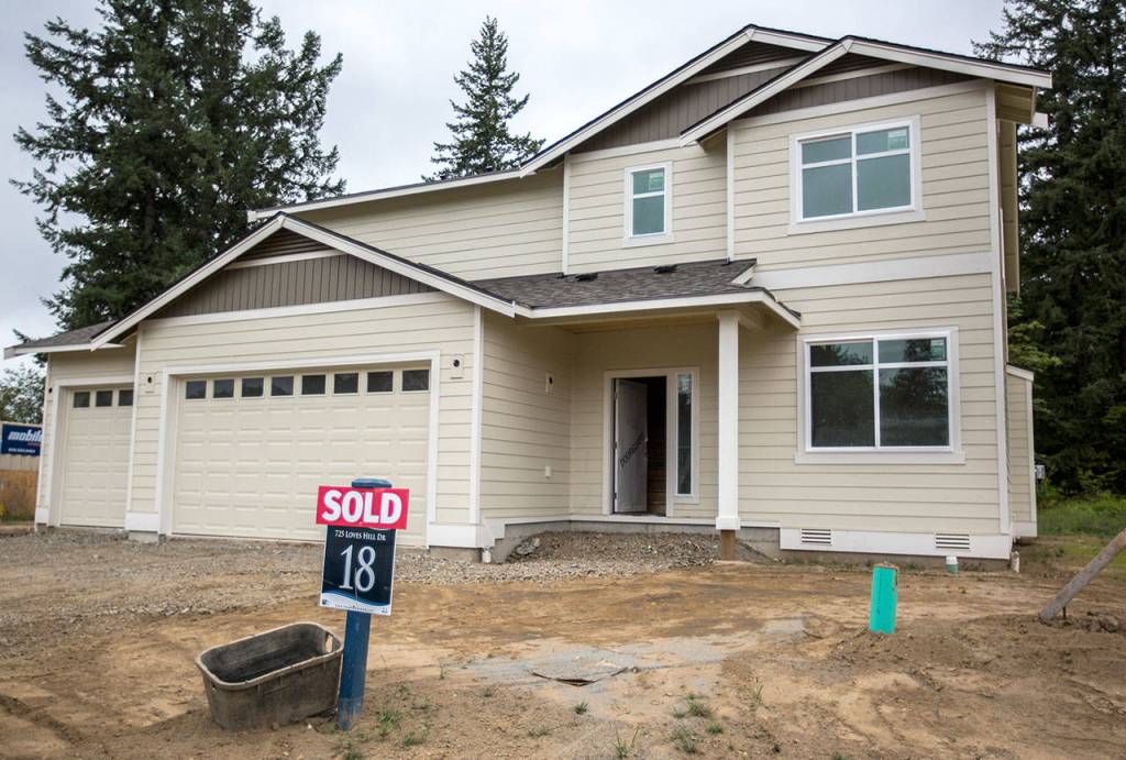 A sold sign sits in front of one of the Cascade Breeze homes on Thursday in Sultan. (Olivia Vanni / The Herald)