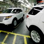 In this 2010 photo, plant employees drive 2011 Ford Explorer vehicles off the assembly line at Fords Chicago Assembly Plant in Chicago. The U.S. government is investigating complaints from Ford Explorer owners who say they smelled exhaust gas inside their SUVs. (AP Photo/M. Spencer Green, File)