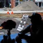 A sign outside Bargreens Coffee on Rucker Avenue pokes fun at the large pile of construction dirt. (Olivia Vanni / The Herald)