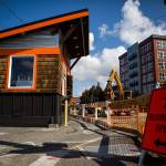 A Businesses Open sign points to the Prestige Coffee thats stand blocked by construction on Rucker Avenue. (Olivia Vanni / The Herald)