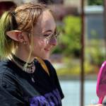 Bailey Frisbie looks over custom elf ears at the Everett Farmers Market on Aug. 4. (Kevin Clark / The Herald)