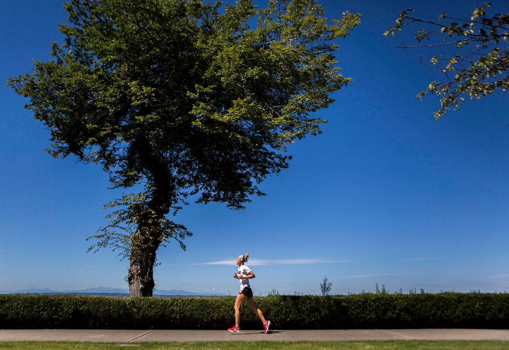 Miranda Granger runs through Grand Avenue Park on July 26 in Everett. (Olivia Vanni / The Herald)