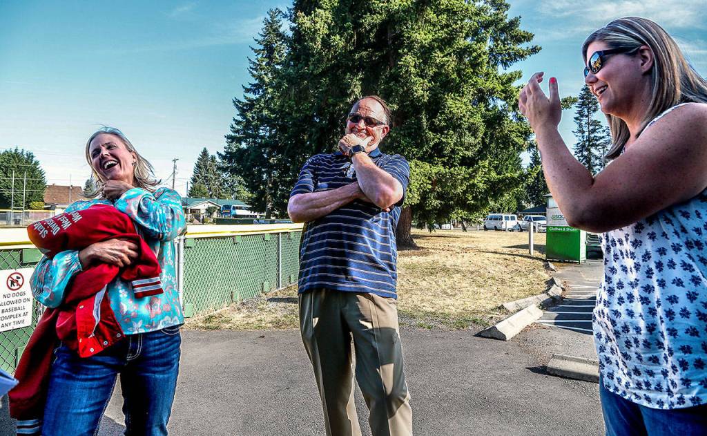 In a streak of humor, former Marysville Little League World Series Softball team manager and head coach Frank Grambo, 63, gets his 1989 players Heidi Hale (left) and Jodie Bilow cracking up with laughter. (Dan Bates / The Herald)