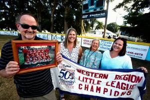 Manager and head coach Frank Grambo and former players, Jodie Bilow, Heidi Hale and Jami Nyblod get ready to welcome the rest of the Marysville Little League Softball World Series team of 30 years ago. They will get together Saturday at Wenberg County Park. (Dan Bates / The Herald)
