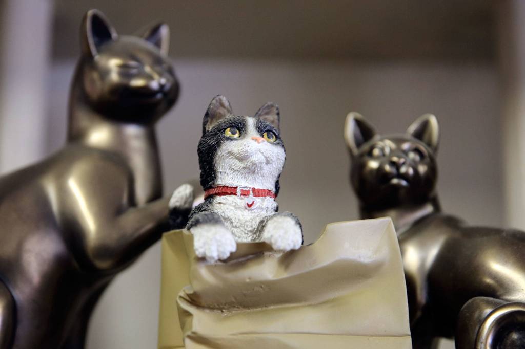 Andersen Insurance of Everett is home to cat figurines that dot the office space. (Kevin Clark / The Herald)