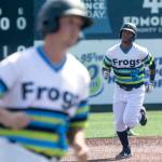 Andy Bronson / The Herald                                The AquaSoxs Robert Perez (rear) follows Trent Tingelstad to home plate after Perez hit a three-run homer against Hillsboro on Tuesday in Everett.