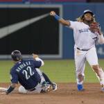 The Blue Jays Vladimir Guerrero Jr. throws to first after forcing out the Mariners Omar Navarez during the sixth inning of a game on Aug. 16, 2019, in Toronto. (Fred Thornhill/The Canadian Press via AP)
