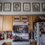 Wizard of Oz character sketches picked up by a family member hang on the wall over her kitchen which is also filled with Wizard of Oz items on Friday, Aug. 16, 2019 in Granite Falls, Wash. (Olivia Vanni / The Herald)