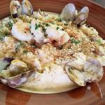 The seafood risotto at Emorys is filled with prawns, scallops and clams, and topped with a panko crust and Parmesan cheese. (Sharon Salyer / The Herald)