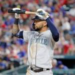Seattles J.P. Crawford holds his bat over his head as he walks away from the plate after striking out during a July 31 game against the Rangers in Arlington, Texas. (AP Photo/Tony Gutierrez)