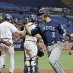 Seattles Tom Murphy (2) celebrates with J.P. Crawford (3) and Austin Nola (23) after Murphy hit a three-run home run off Tampa Bays Brendan McKay during the first inning the Mariners 9-3 win Monday in St. Petersburg, Florida. (AP Photo/Chris OMeara)