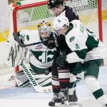 Ian Walker of the Everett Silvertips (4) battles for control of the puck in front of the Everett net during a game against the Spokane Chiefs on Nov. 18, 2018, in Everett. (Olivia Vanni / The Herald)
