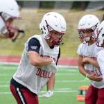 Senior running back Davanta Murphy-McMillian practices hand-offs at Cascade High School on Wednesday, Aug. 21. (Katie Webber / The Herald)