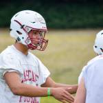 Junior Miles Fabre talks to his teammates during defense drills at Cascade High School on Wednesday, Aug. 21. (Katie Webber / The Herald)