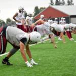 Senior running back Davanta Murphy-McMillian (left) gets set for a kickoff drill at Cascade High School on Wednesday, Aug. 21. (Katie Webber / The Herald)
