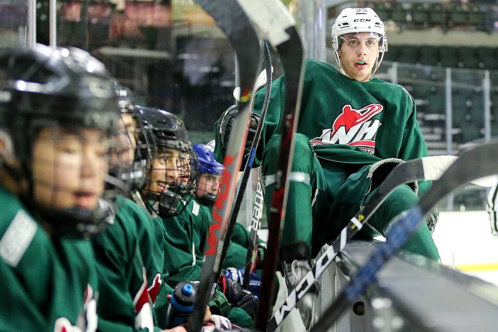Gage Goncalves (right) waits on the bench during Silvertips training camp on Aug. 22, 2019, at Angel of the Winds Arena in Everett. (Kevin Clark / The Herald)