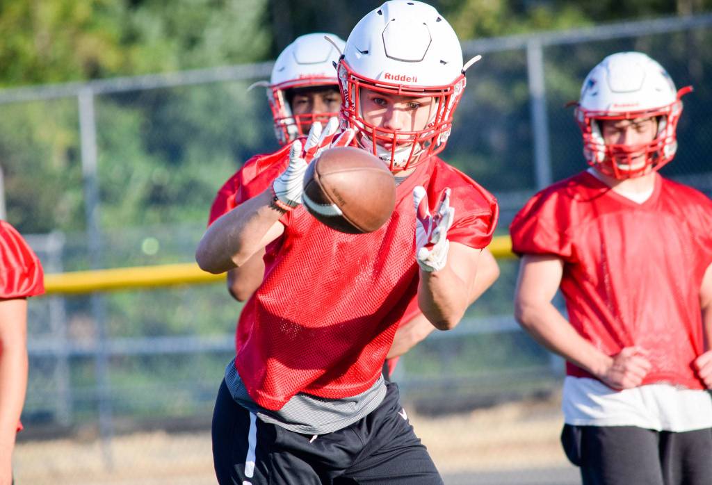 Senior Marcos Sanchez catches the ball during running back drills at Mountlake Terrace High School on Thursday, Aug. 22. (Katie Webber / The Herald)